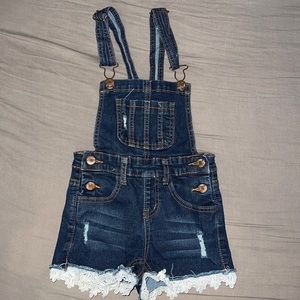 Girls Jean shorts romper. Lace on the bottom.